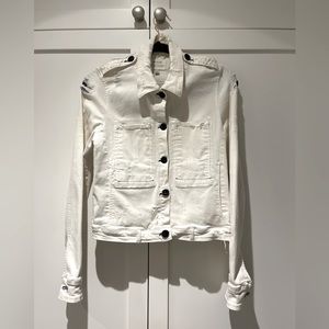 Maguire intentionally ripped white jean jacket. Perfect condition.